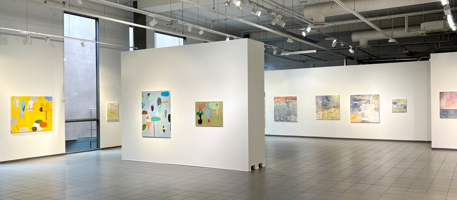 Paintings by Jyrki Setälä and Anne Ovaska in a bright gallery space in May 2023