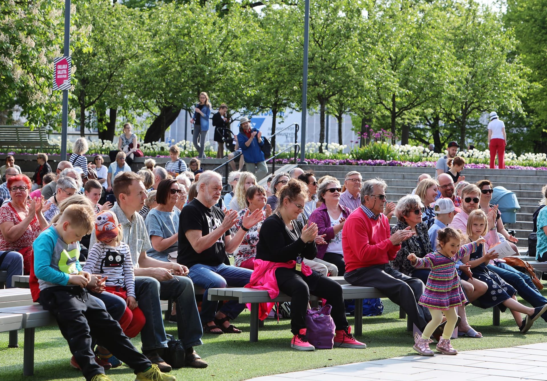 Audience enjoying an outdoor event during the festival