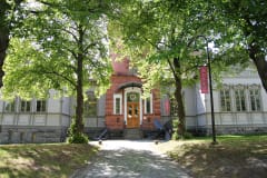 Photo of the museum building and the museumu0026#039;s tower in the summer.