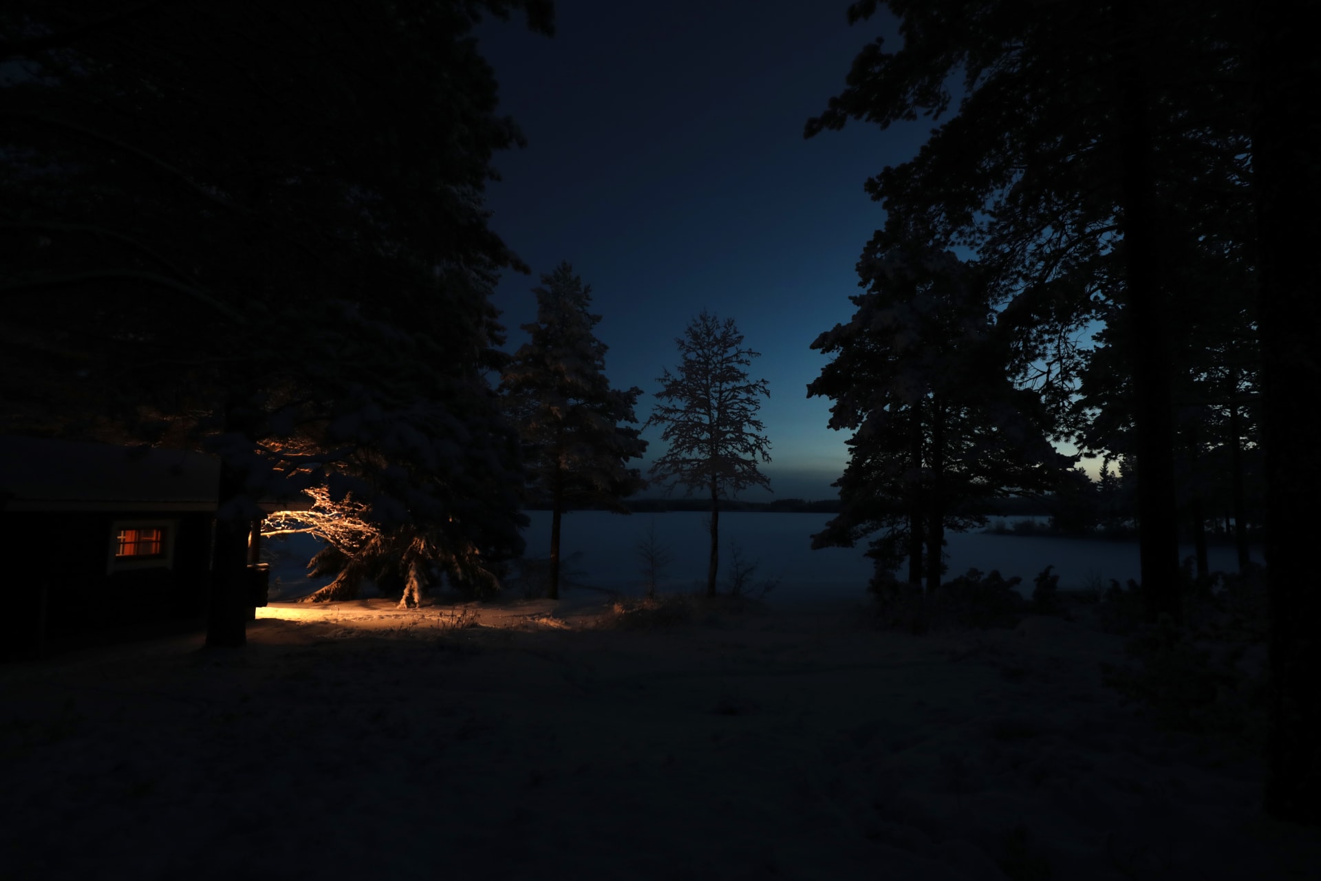 Villa Cone Beach log sauna at the lakefront invites bathers to experience relaxation in steamy löyly, with snow waiting for daredevils to roll in it.