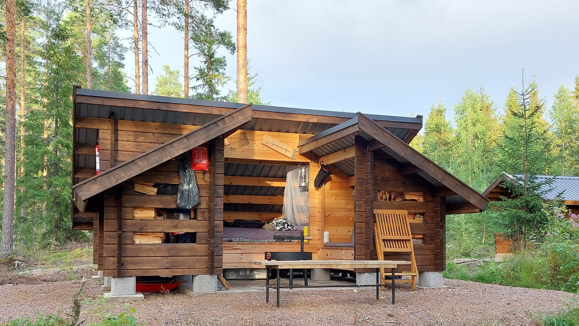 The campfire by the lean-to shelter 