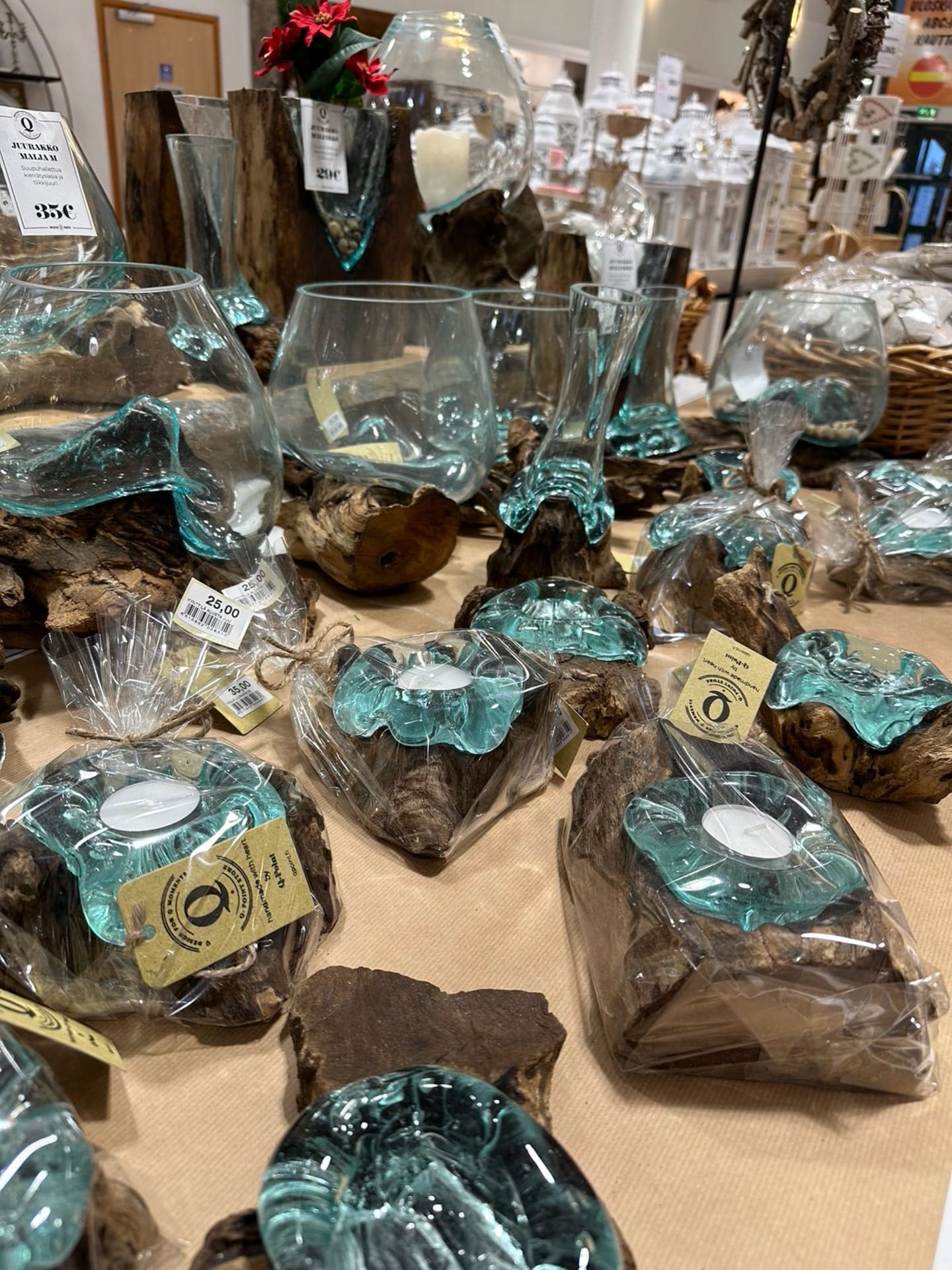 candle holders and vases from teak wood and recycled glass made by hands