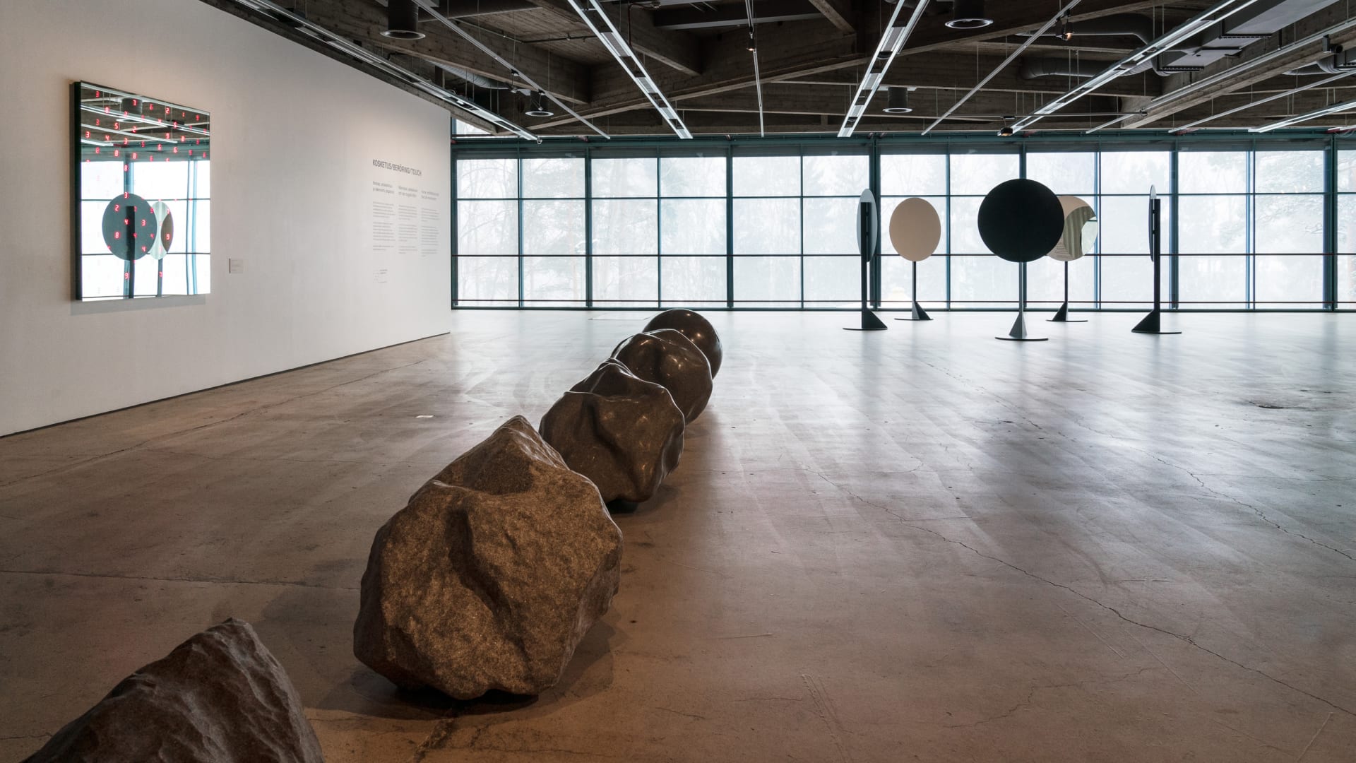 Bright exhibition space with contemporary art installations.