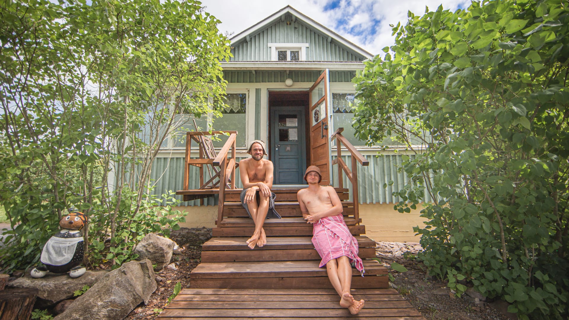 Juha and Matti sitting on the porch of Nekalan Puutarha public sauna