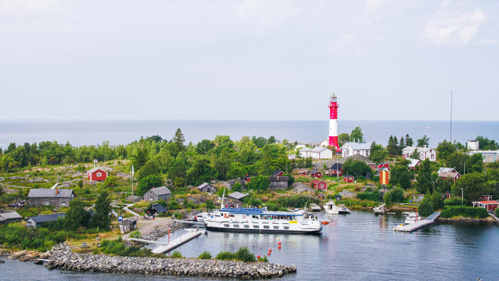 The lighthouse island of Tankar from above with M/S Jenny parked in the harbour.