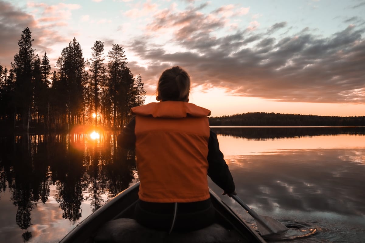 Fishing-school in Rukajärvi Lake with canoes