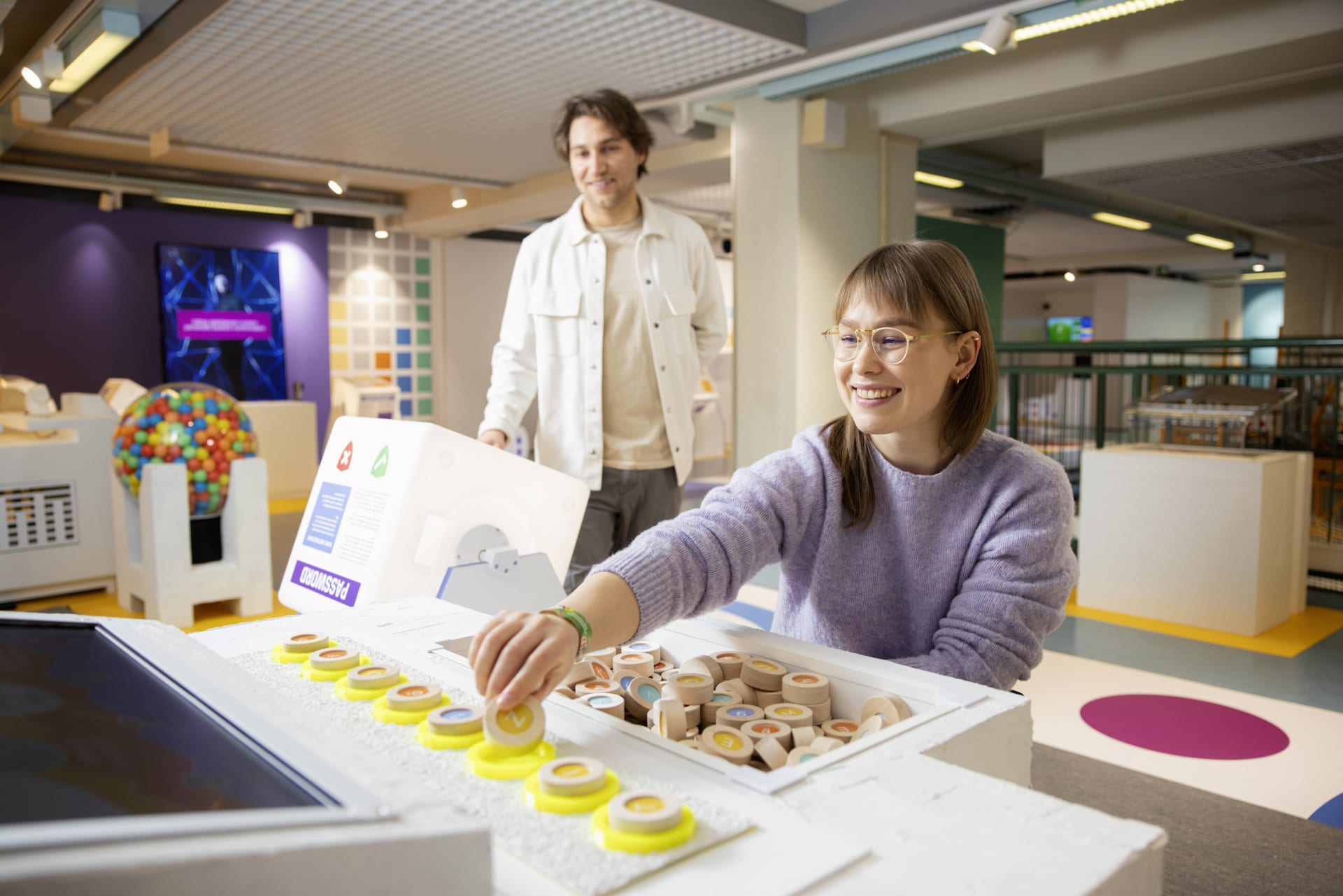 A woman testing Tietomaa's object. Other functional objects in the background.
