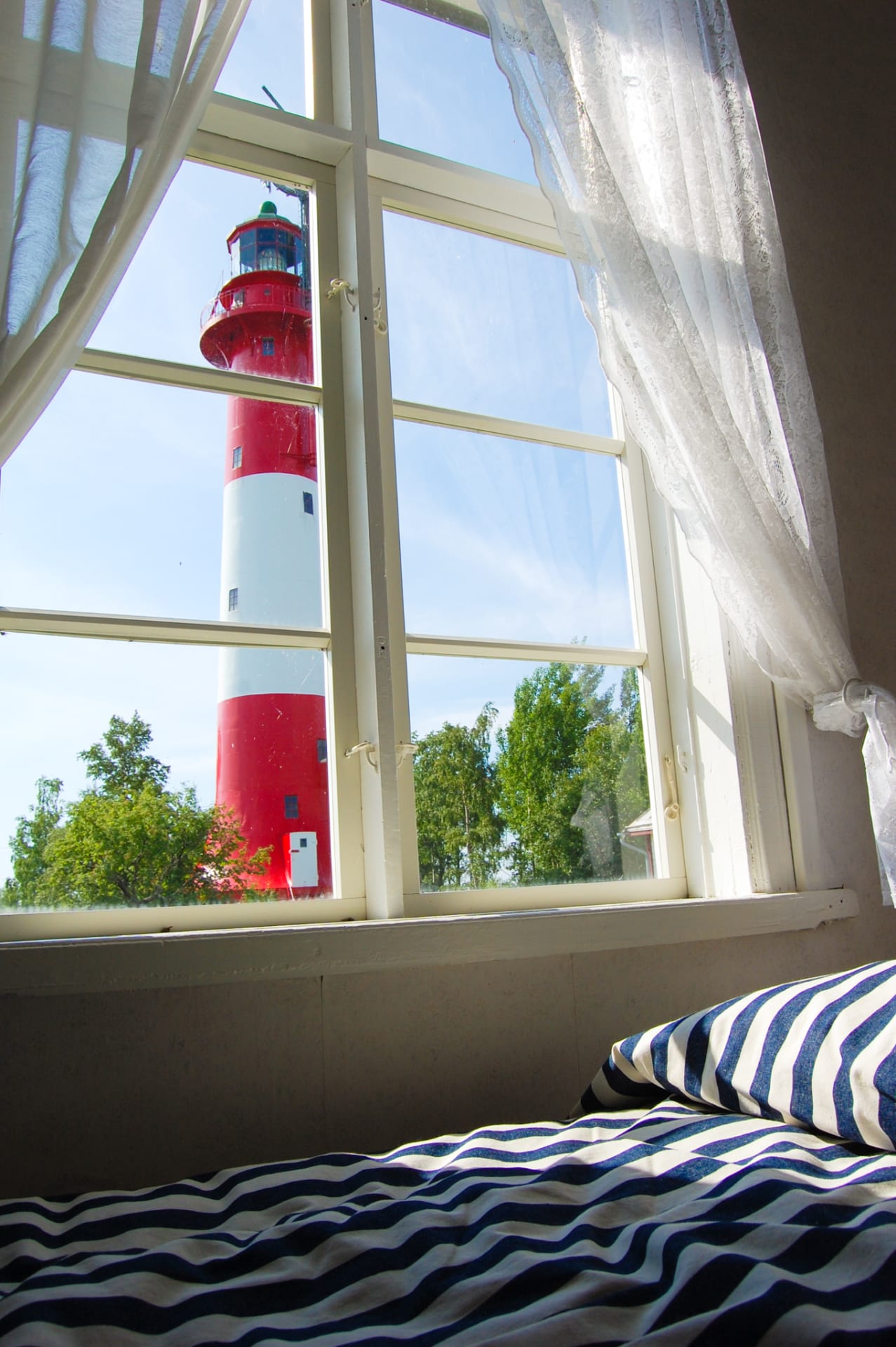 The view through the window to the lighthouse 