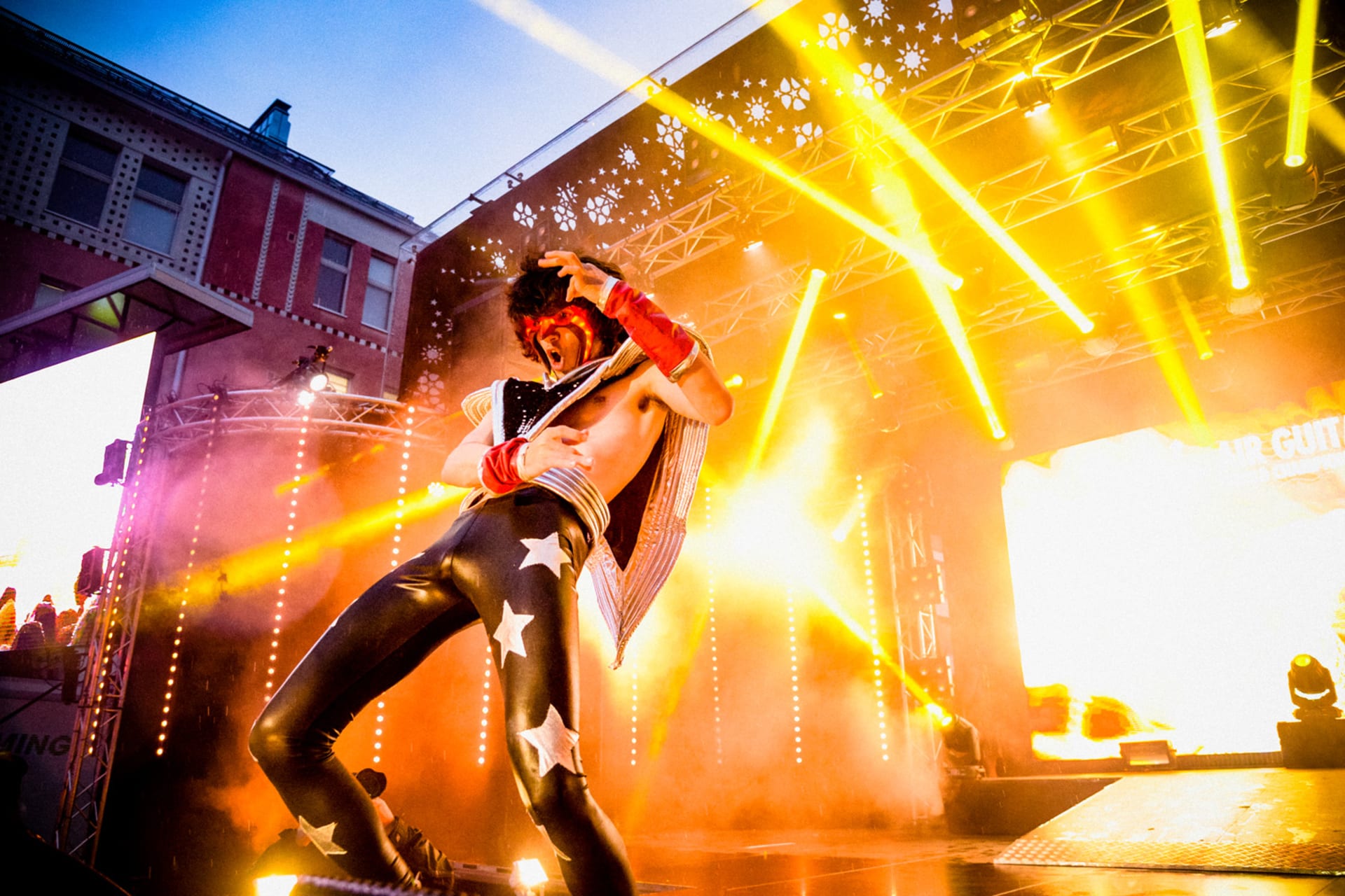 a man playing air guitar on Air Guitar World Championships stage