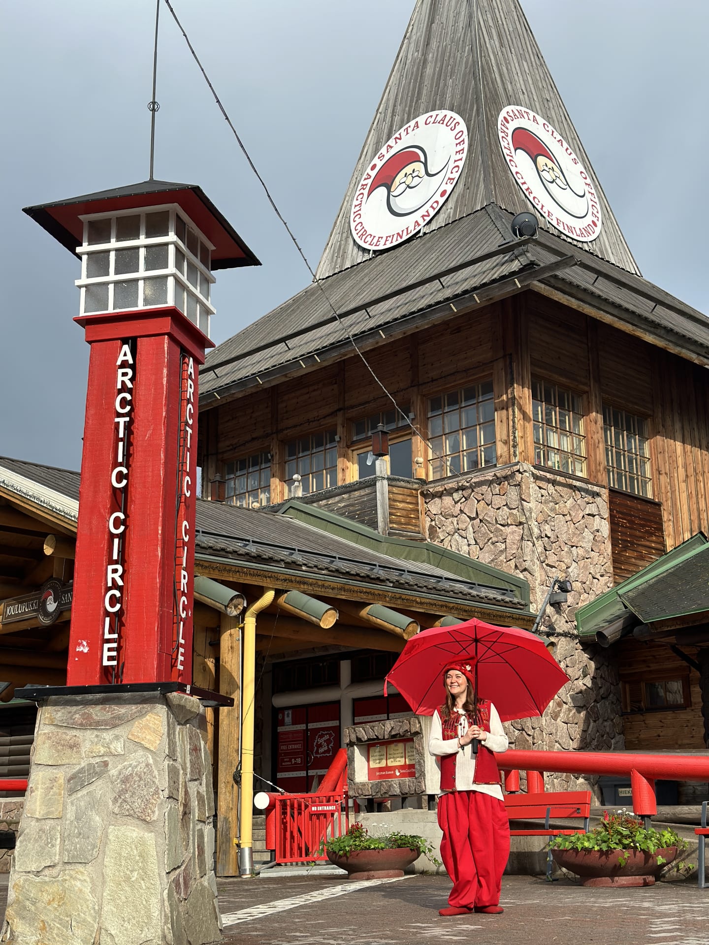 Vanilla the elf outside with an umbrella