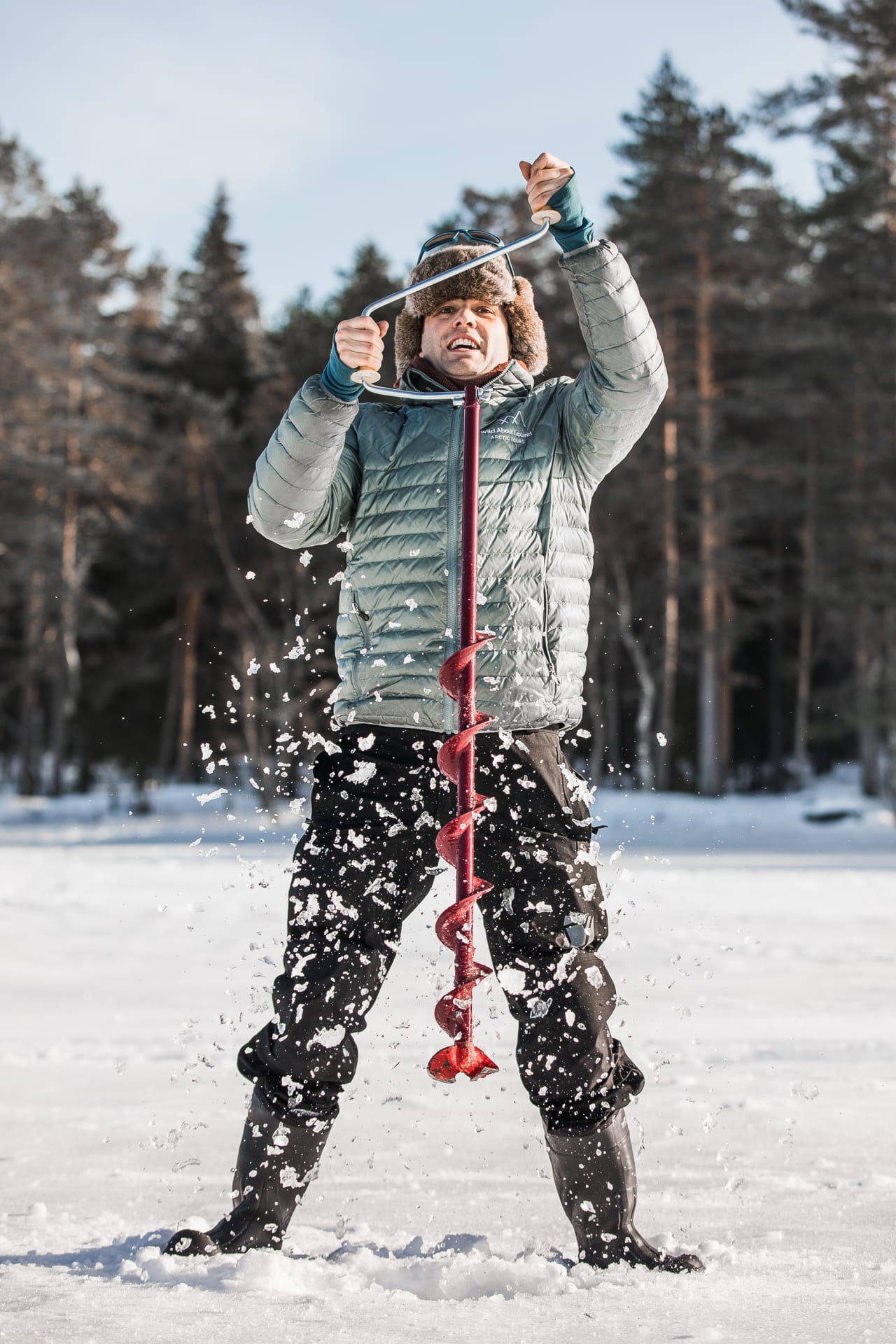 Drilling the hole in the ice