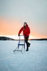 Kick sledding on the frozen lake
