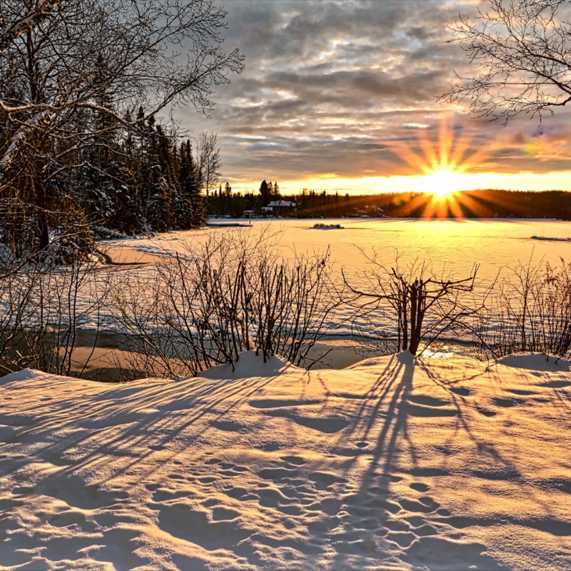 Sunset over frozen lake in Finland
