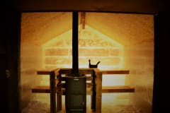 Sauna stove inside an ice sculpted sauna.