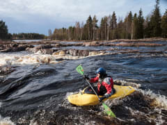 White water kayaker in Koitelinkoski river.