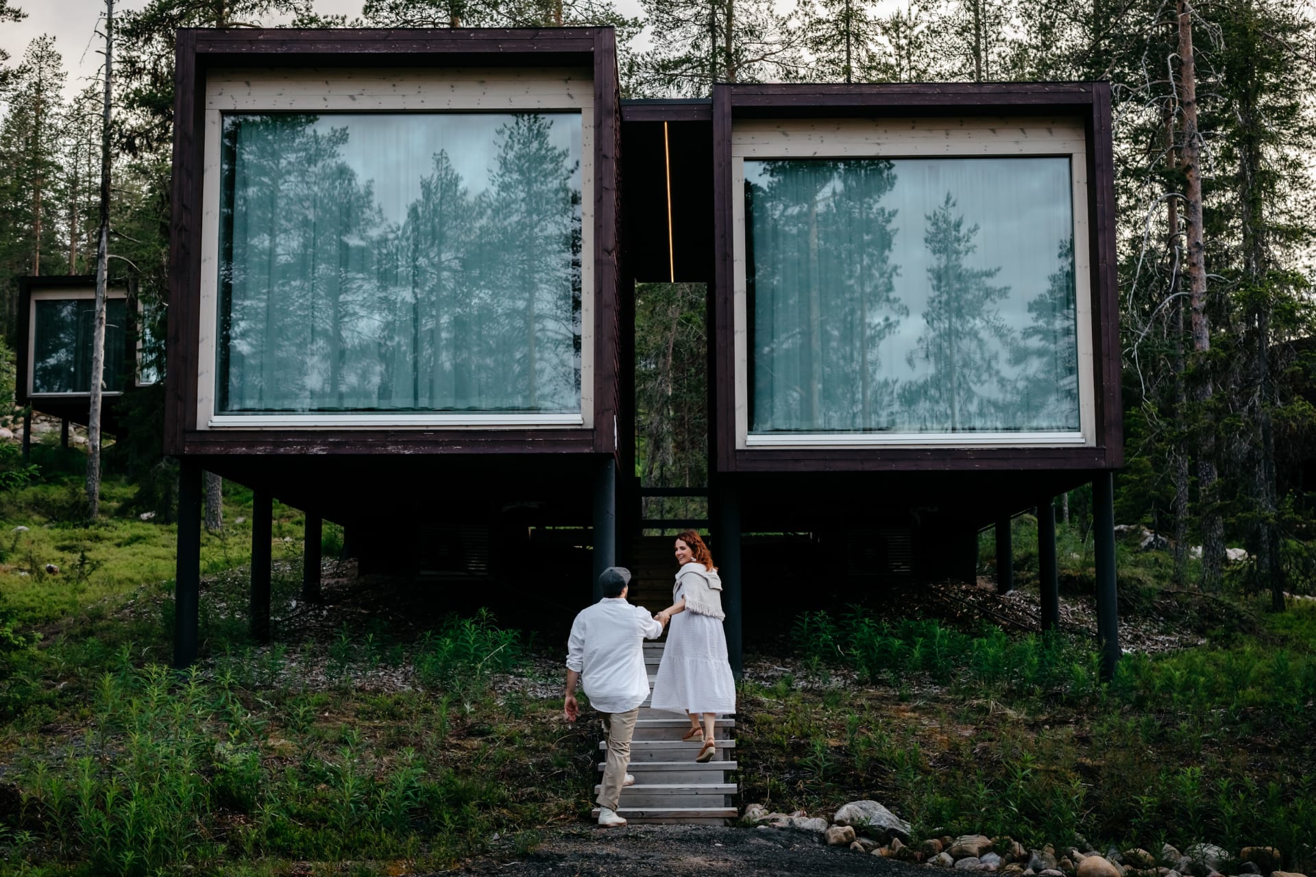 Couple entering the suite on summer night