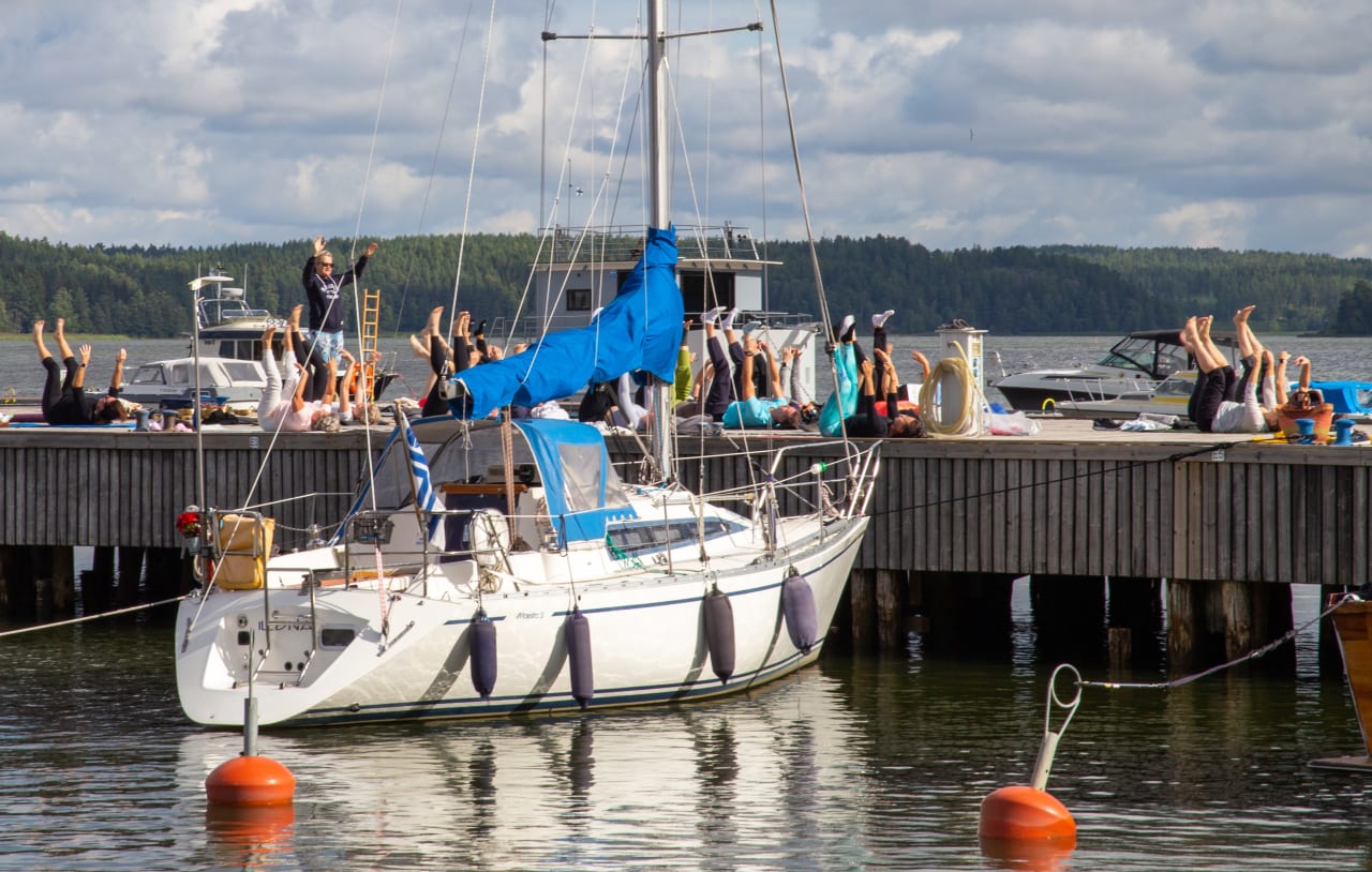 Yoga at the pier with an archipelago sea view.