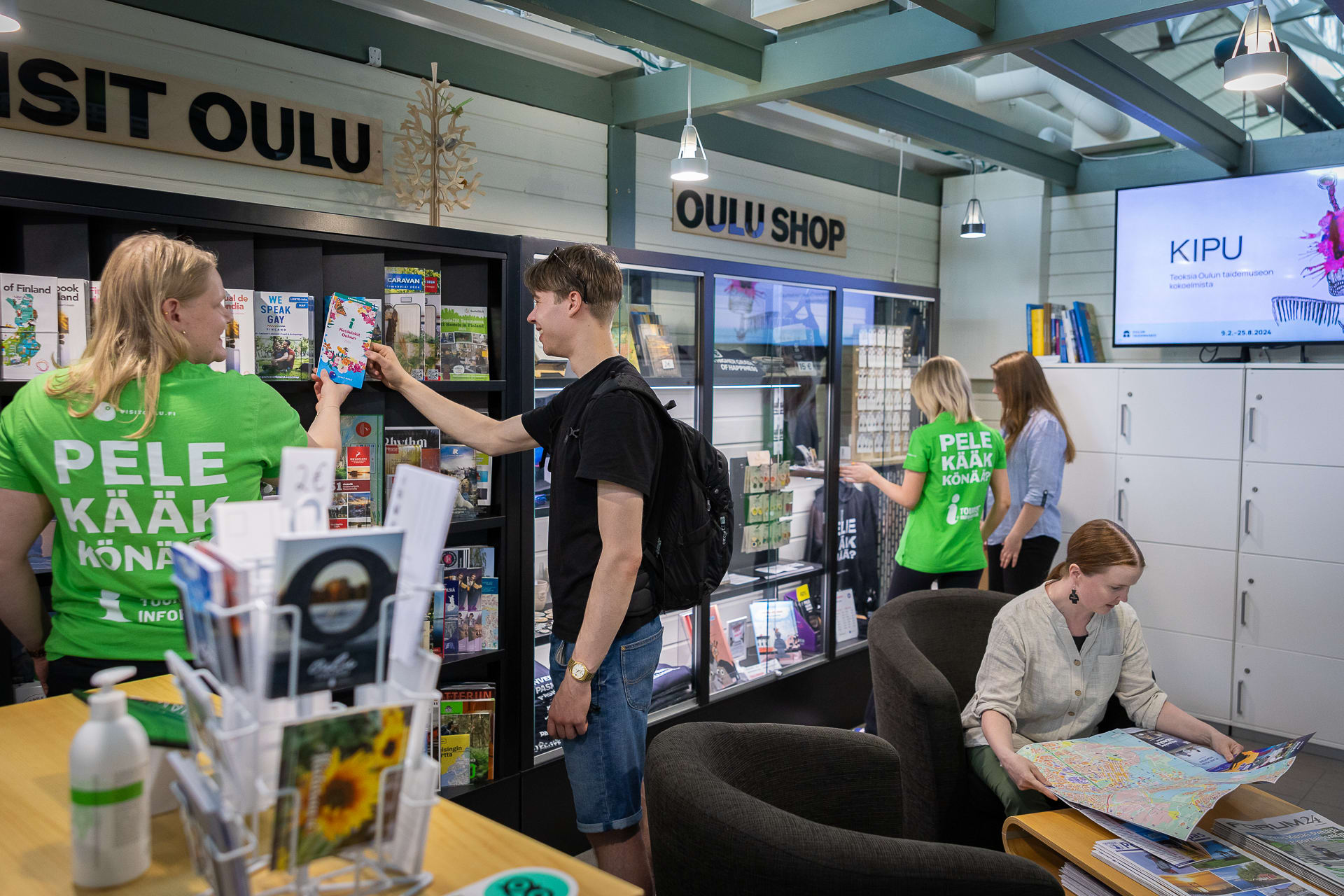 In the tourist office customers can pick up brochures and buy souveniers.