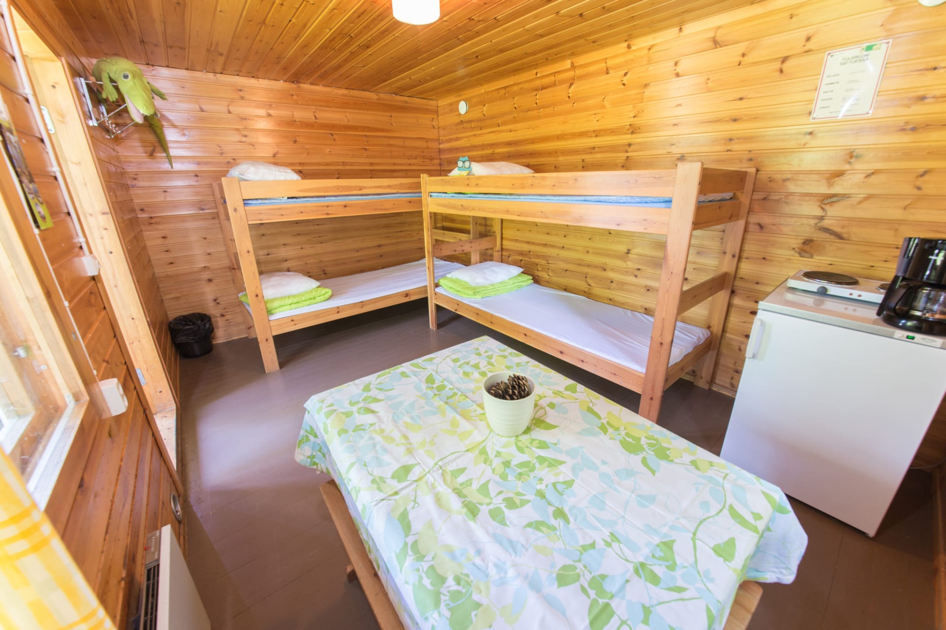 Härmälä Camping has cottages for 4 persons with 2 bunk beds, table, chairs and fridge