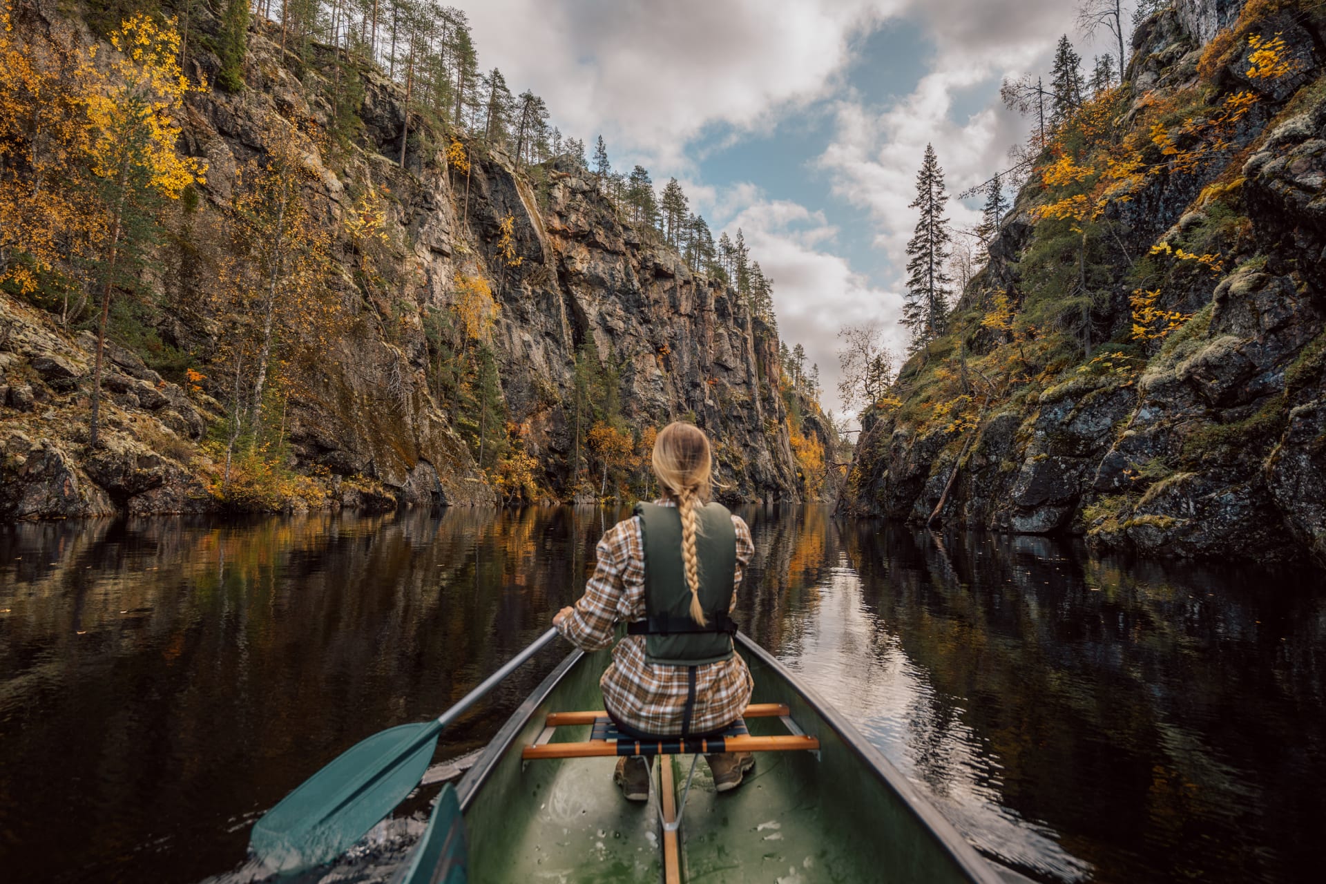 Lady Canoeing in the Julma-Ölkky canyon lake