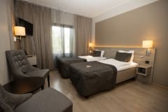 Classic room with two separate beds and two chairs