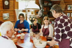 The bakers sitting next to the table.