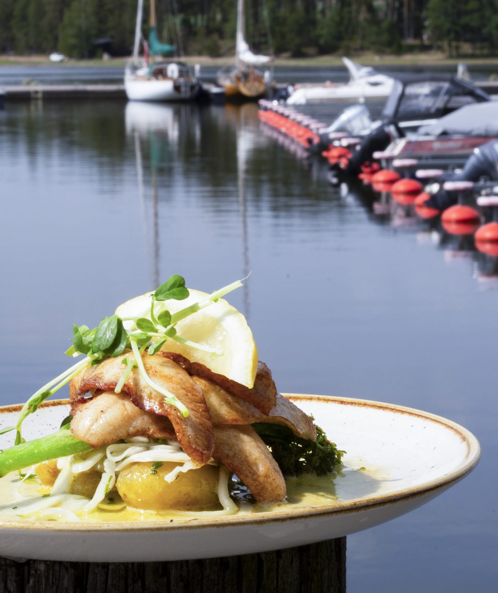 Delicious local food portion on the plate by the seaside settings.