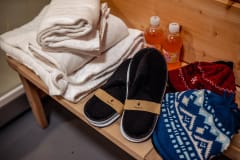 We provide towels, bathrobes, slippers, hats and one fizzy drink