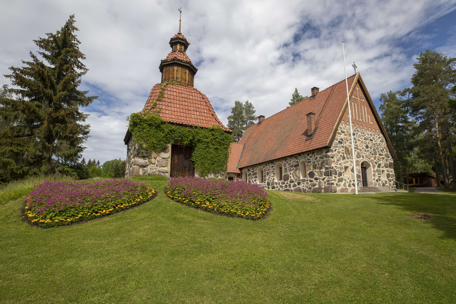 Medieval style church with red tiled roofing.