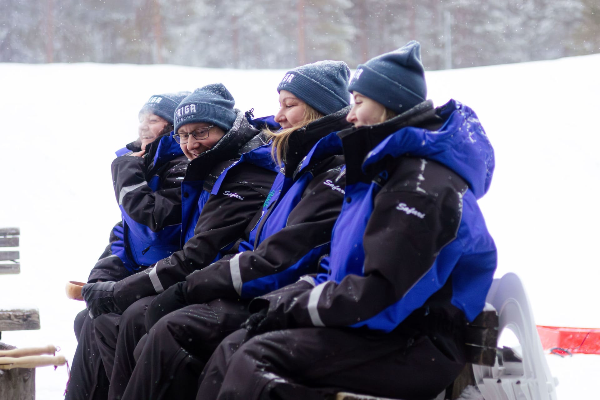 people sitting in warm winter outfit provided by Taiga resort