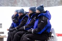 people sitting in warm winter outfit provided by Taiga resort