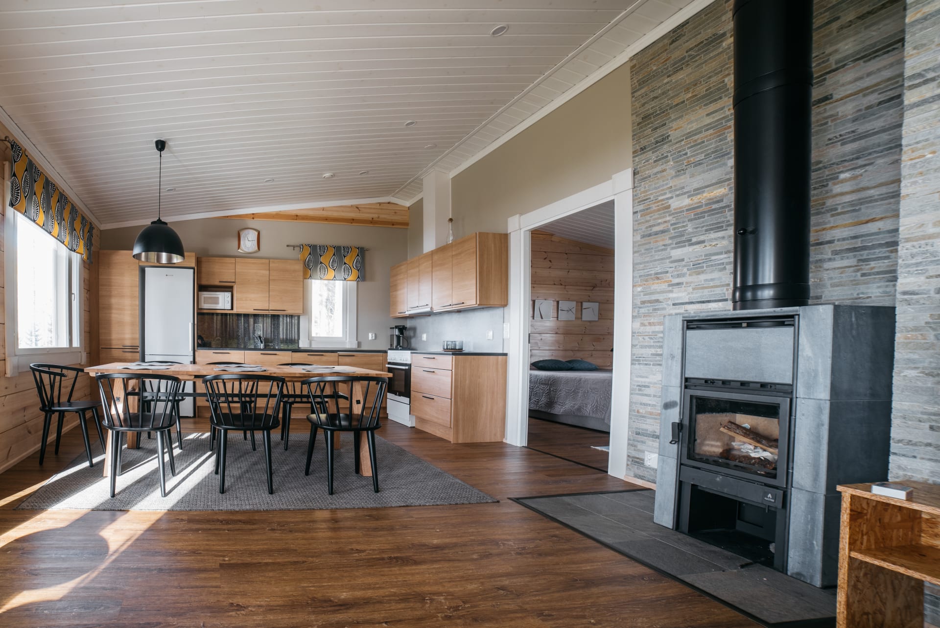 A combined kitchen and living room in Koukku logcottage 