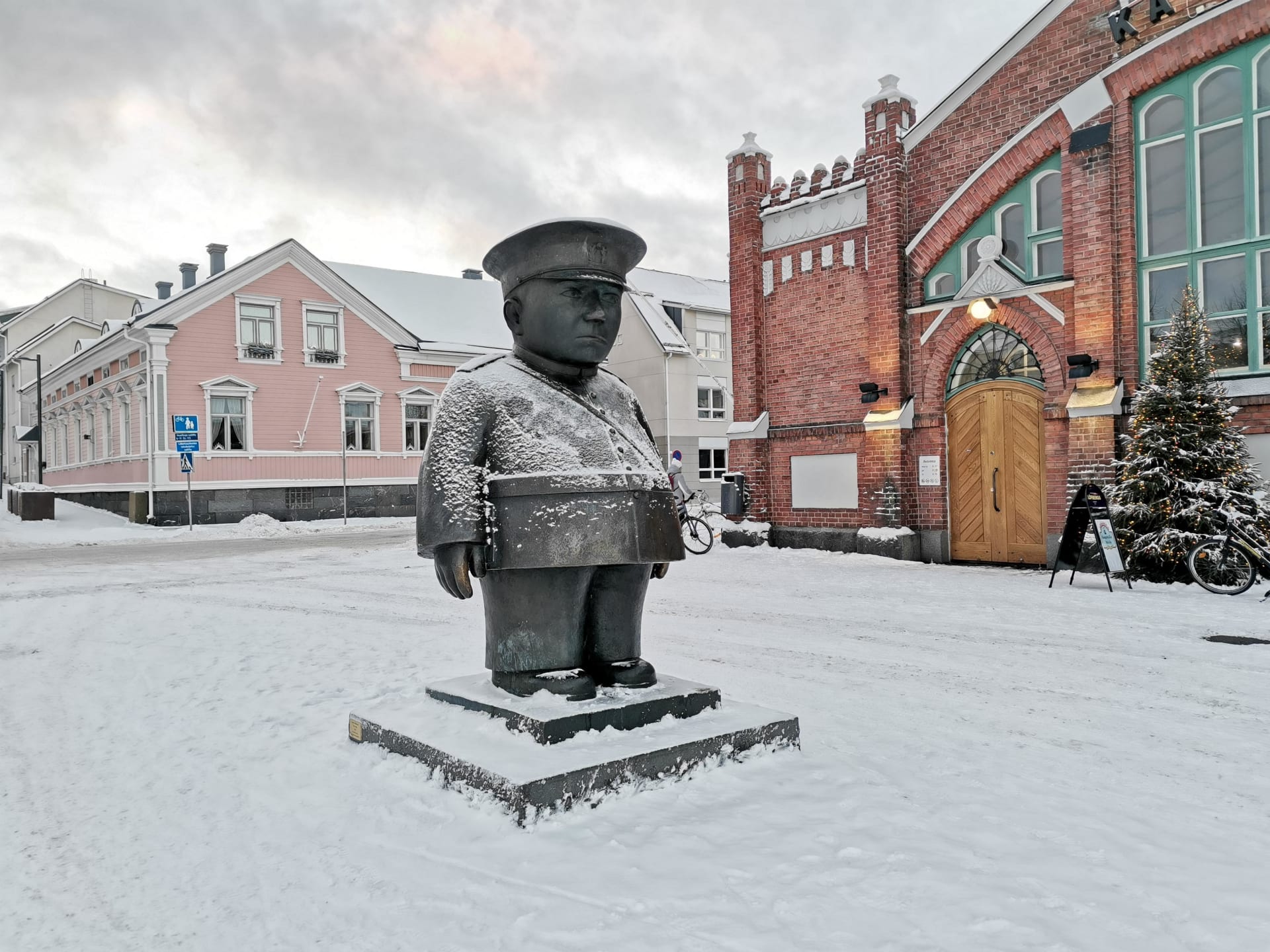 Statue with light snow cover.