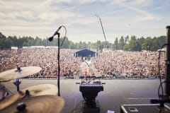 Finnish artist Vesala and the festival crowd at Ilosaarirock's Main Stage in July 2023.