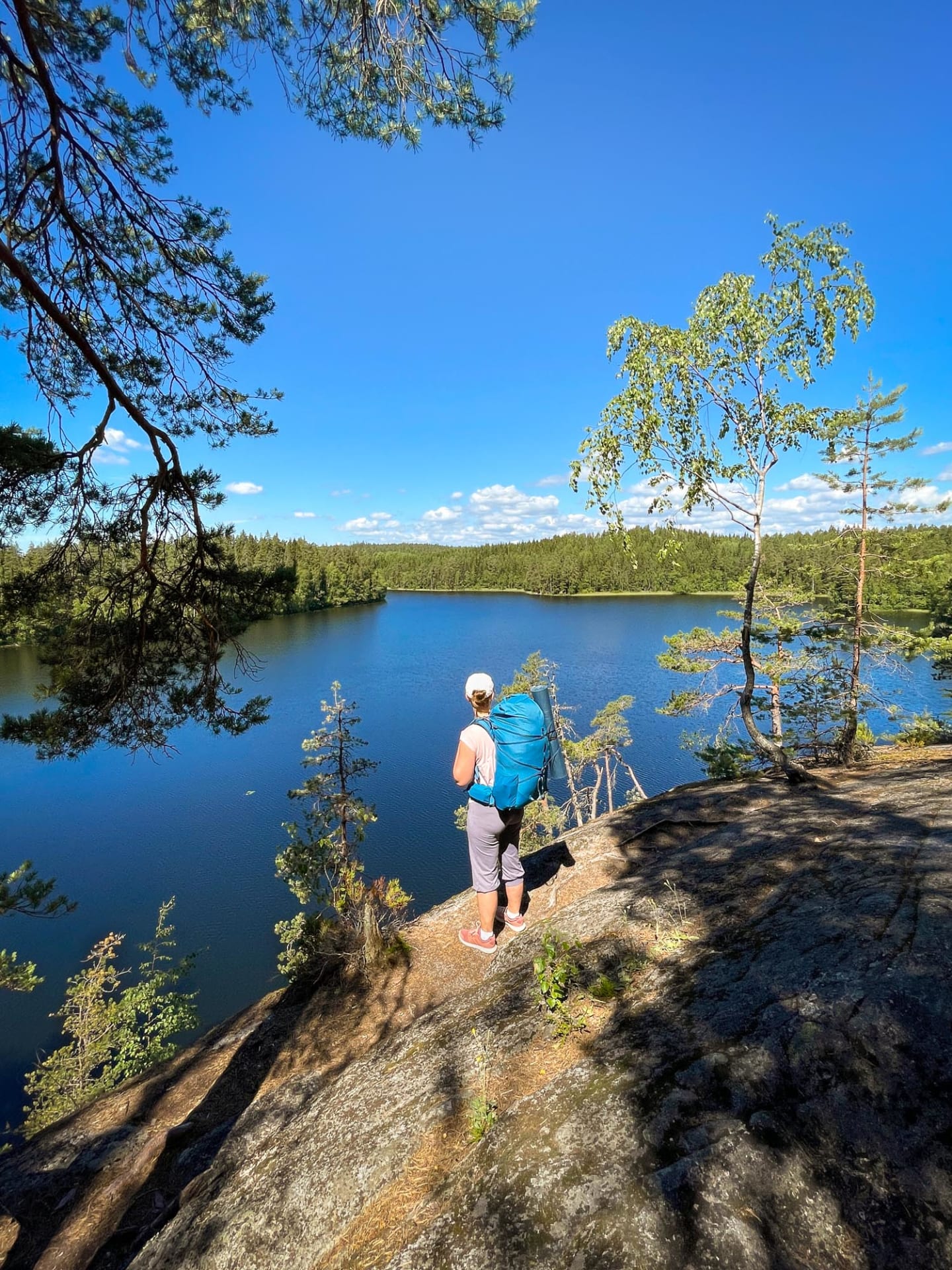 Hiker on a high viewpoint in Nuuksio National Park