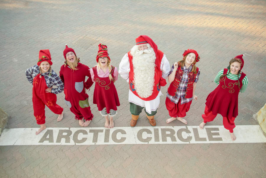 Santa Claus and the elves at the Arctic Circle line in summer time.