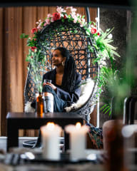 Woman sitting in a chair in hotel lobby