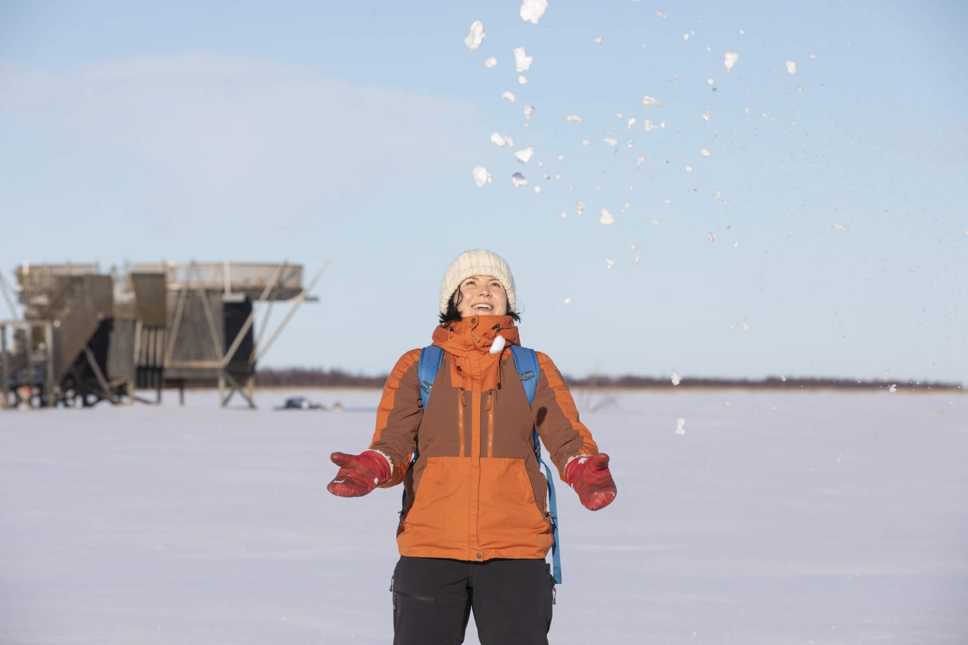 Woman throws snow at Liminka Bay.