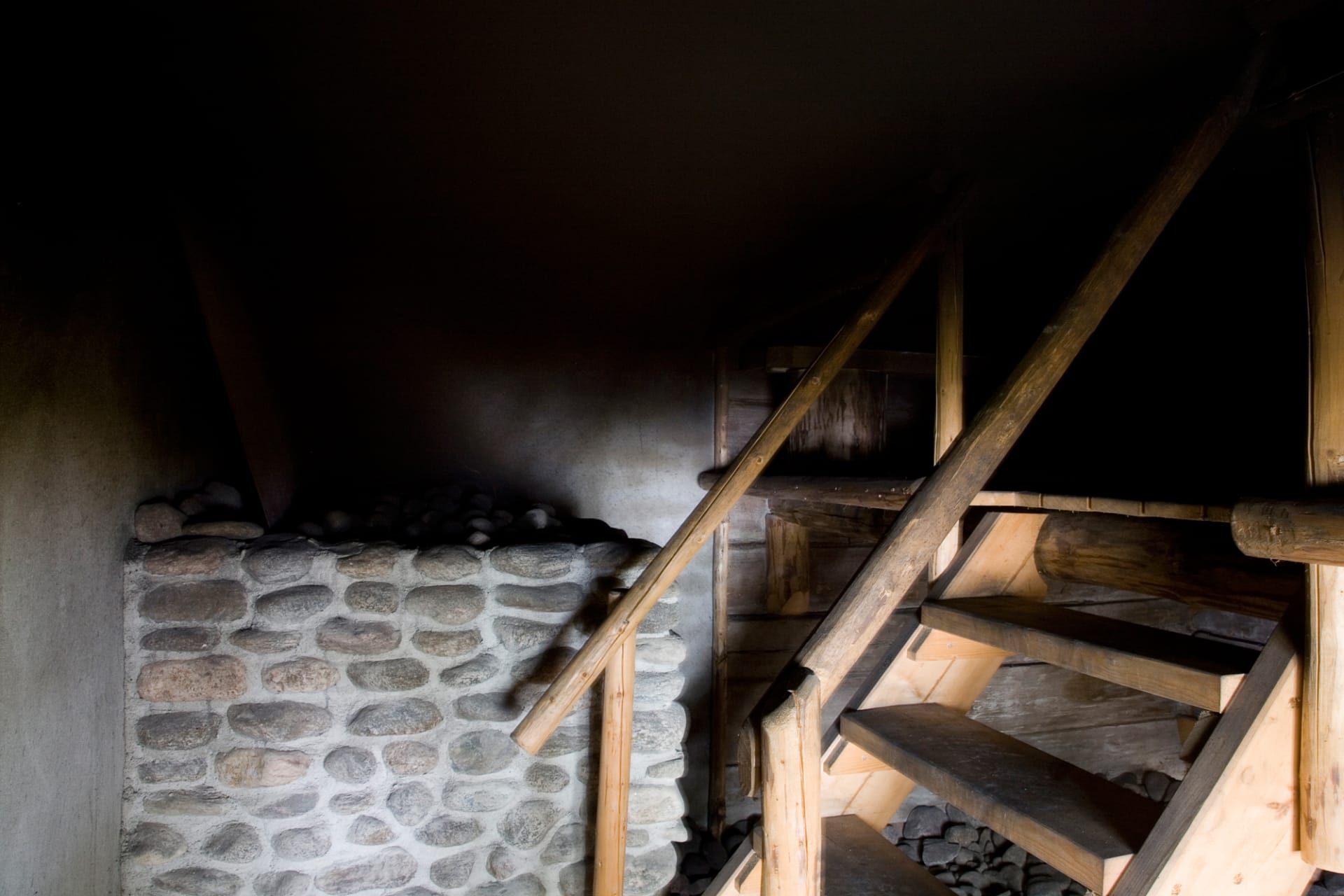 In sauna there is only a small window and the walls and the ceiling are covered in smoke from above the stove.
