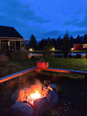 Enjoy the darkening summer evenings in the glow of the campfire.