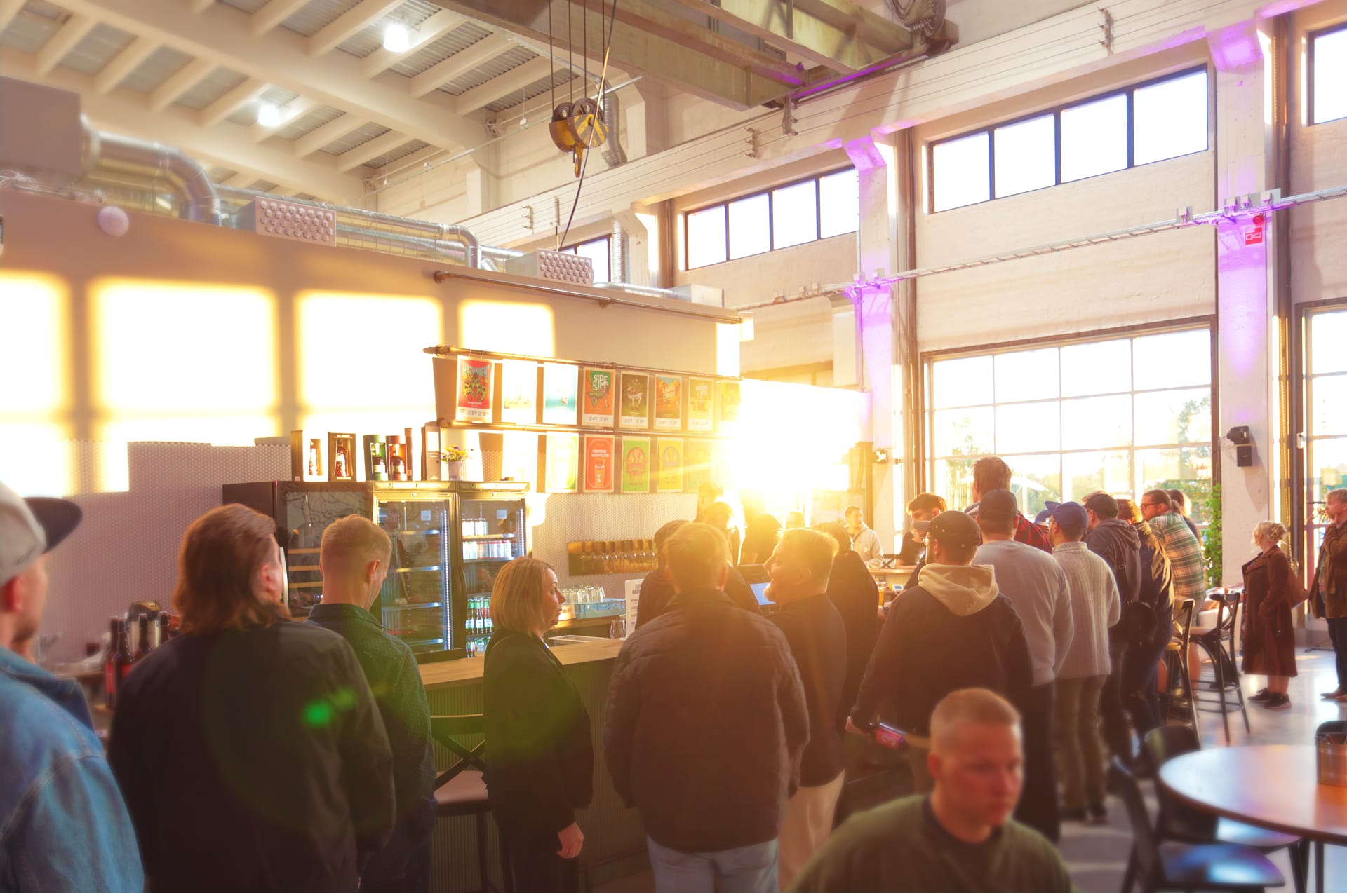 Atmospheric evening at Varikko Taproom with customers and a wide selection of beers on tap