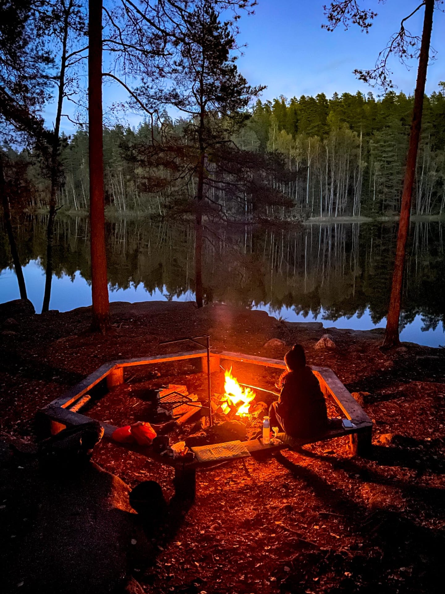 Sitting alone by a campfire in Nuukio National Park