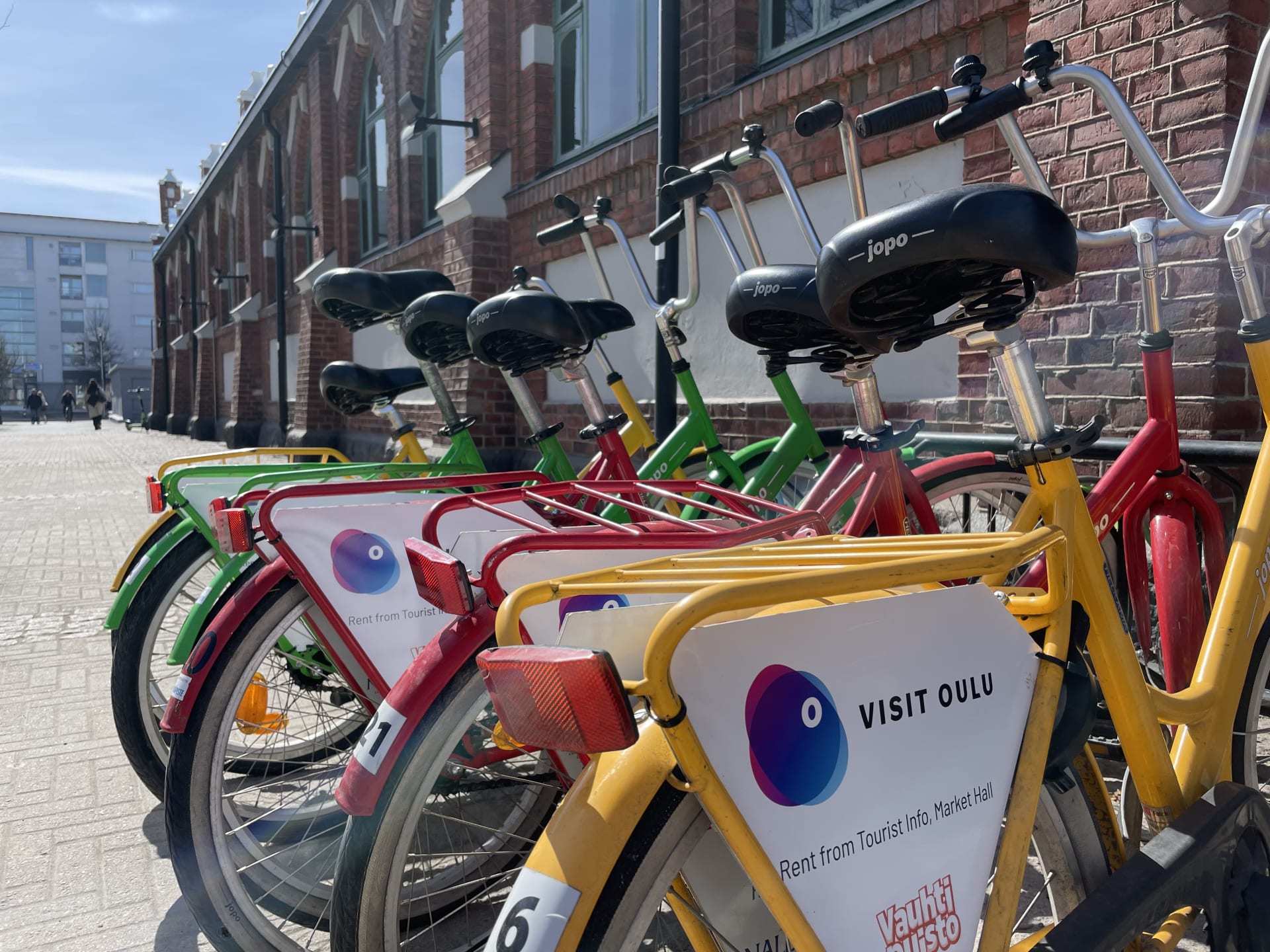 Six rental bikes in a row.