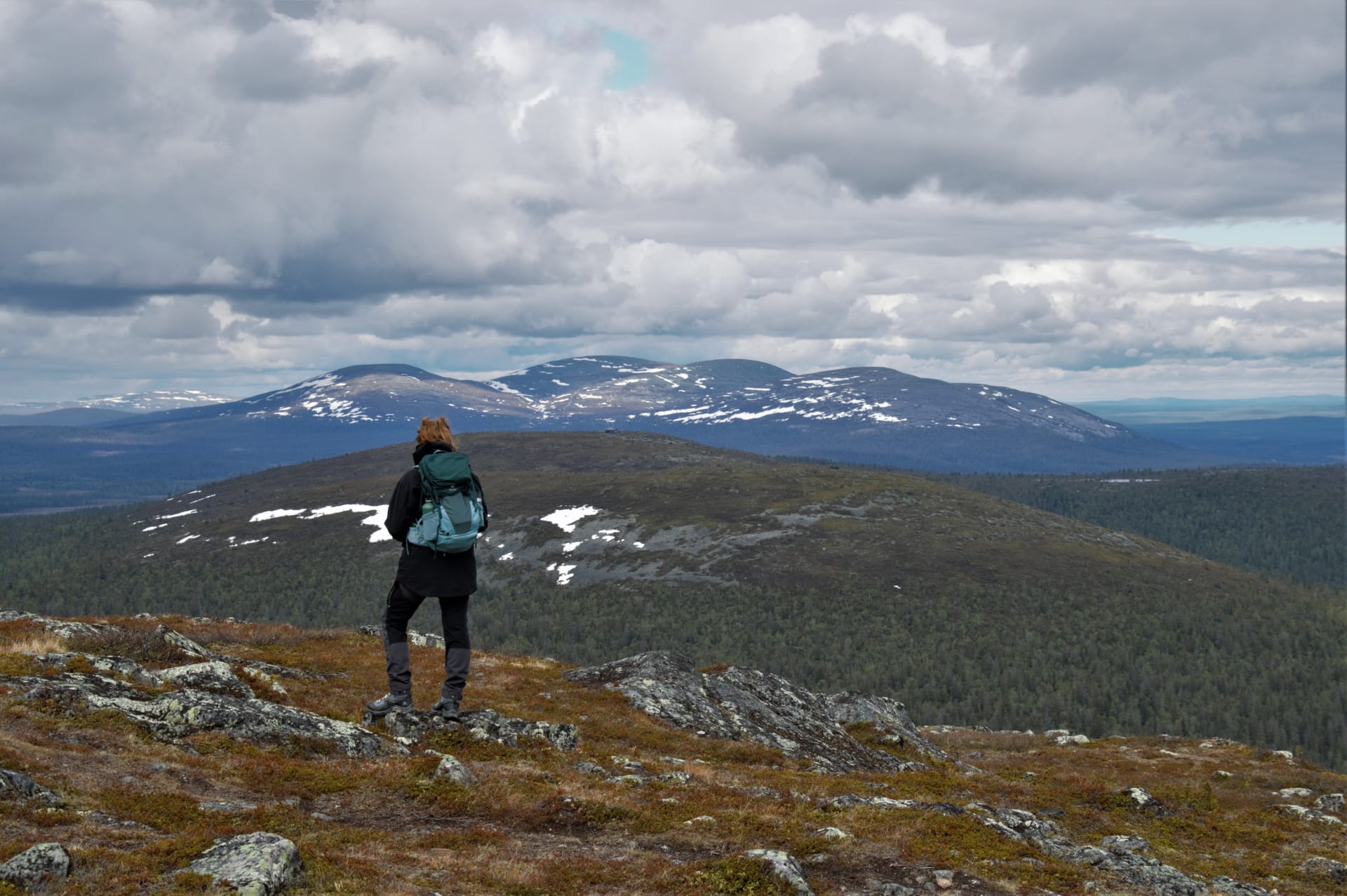 A hiker on a fell with magnificent scenery.