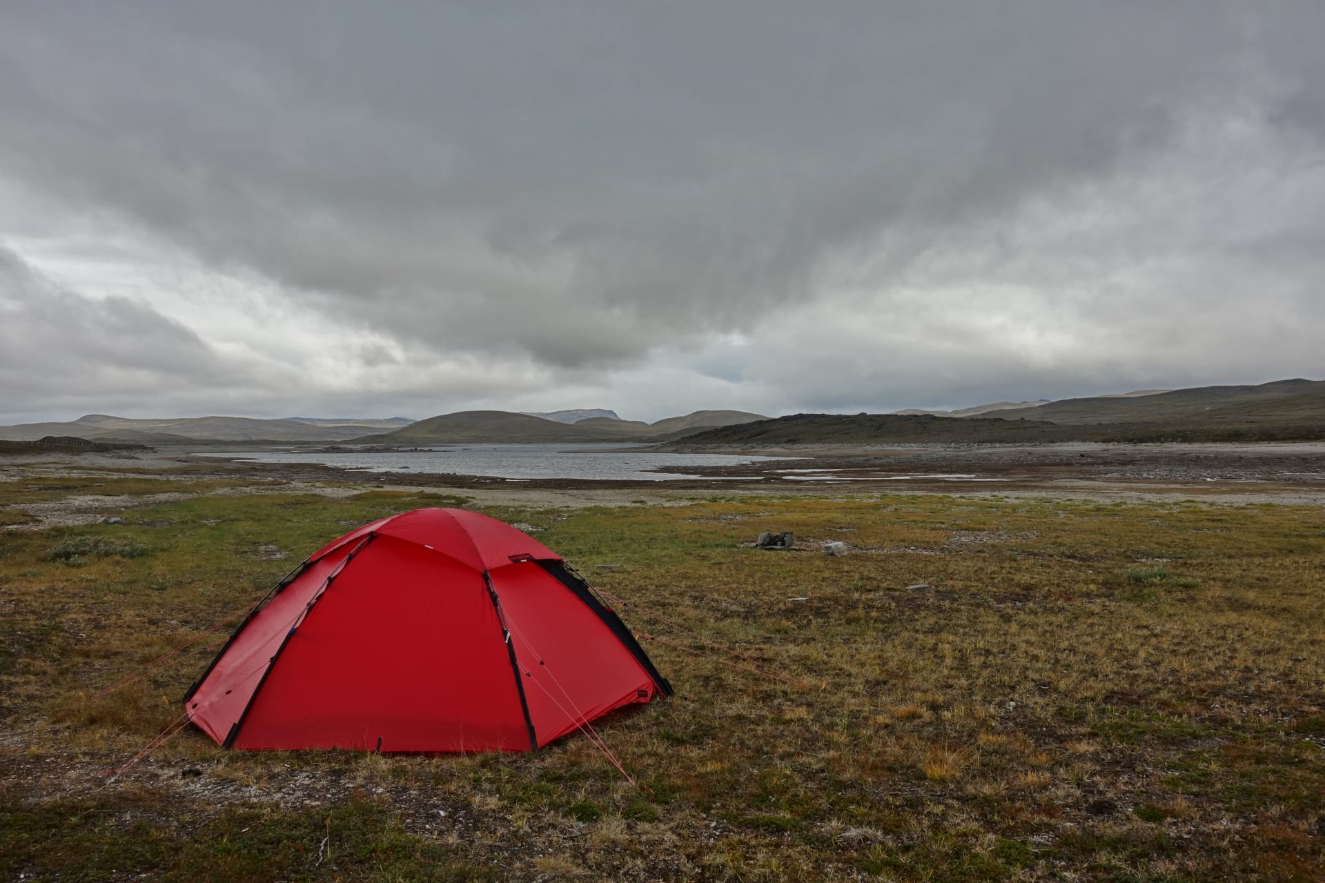 A tent in wide open scenery.