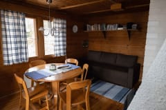 The cottages have a well-equipped kitchen and a cozy living room