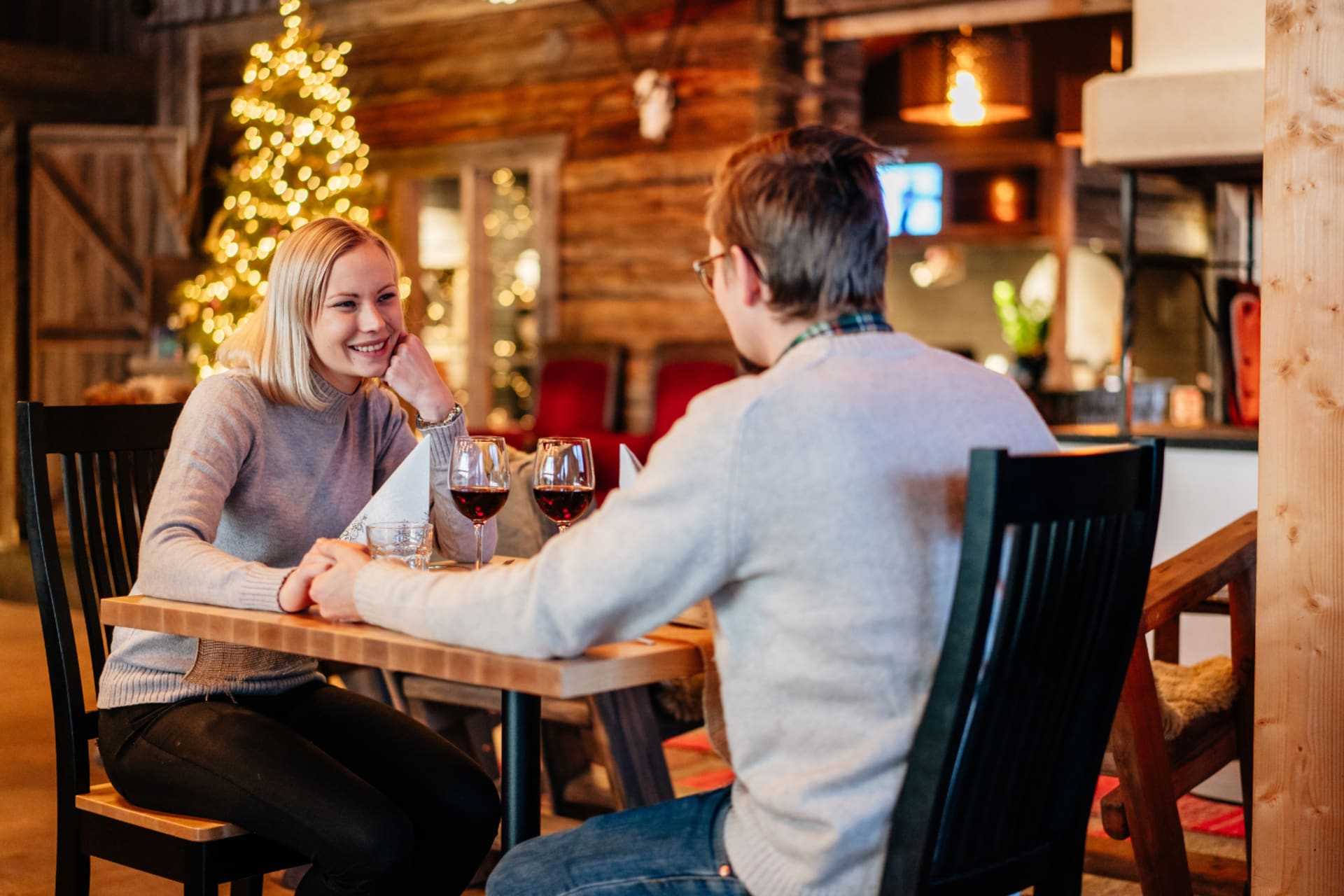 A couple having a dinner in Restaurant Aitta in Apukka Resort Rovaniemi Lapland Finland