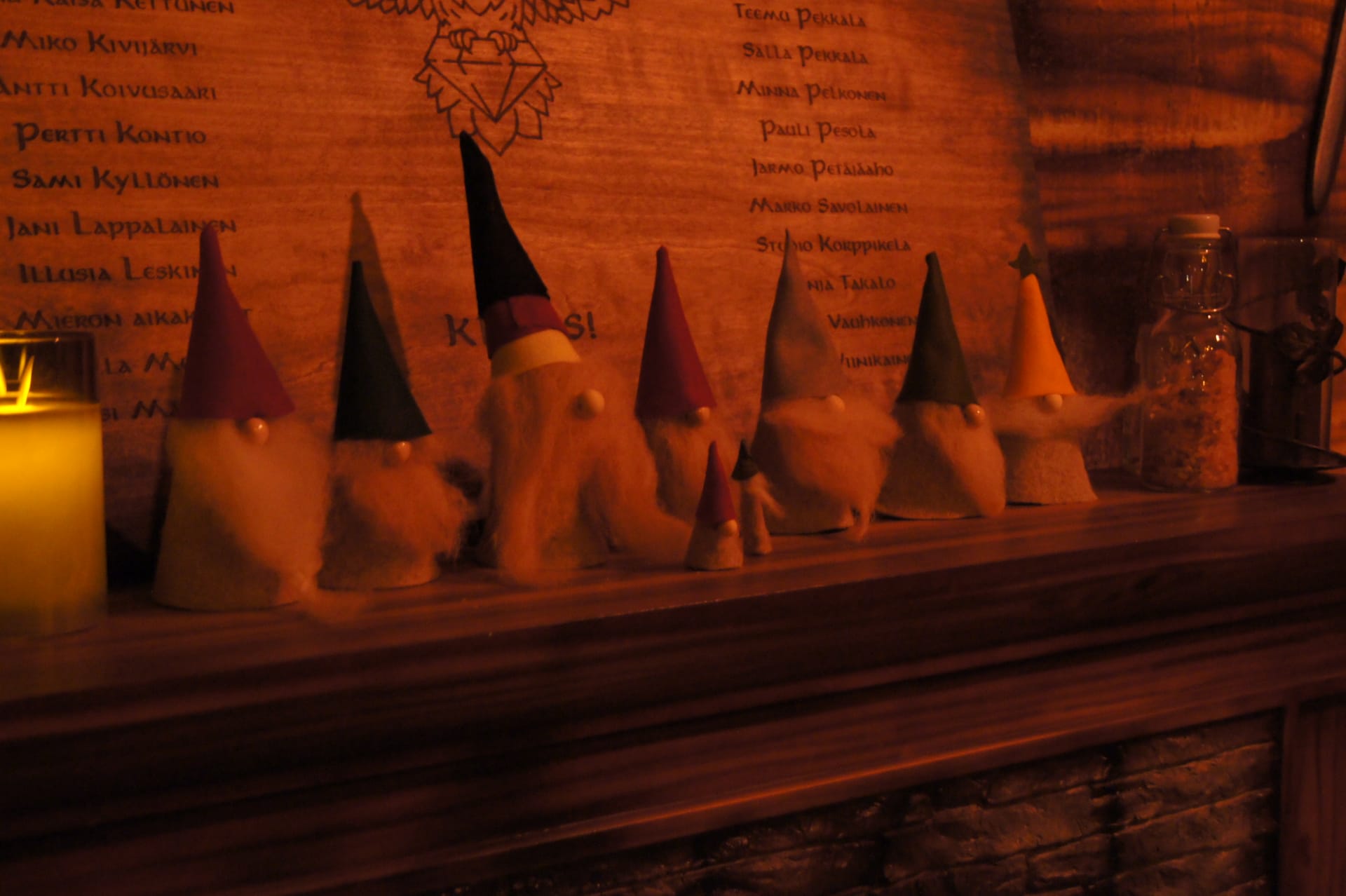 tonttu figurines placed in a row on a mantlepiece