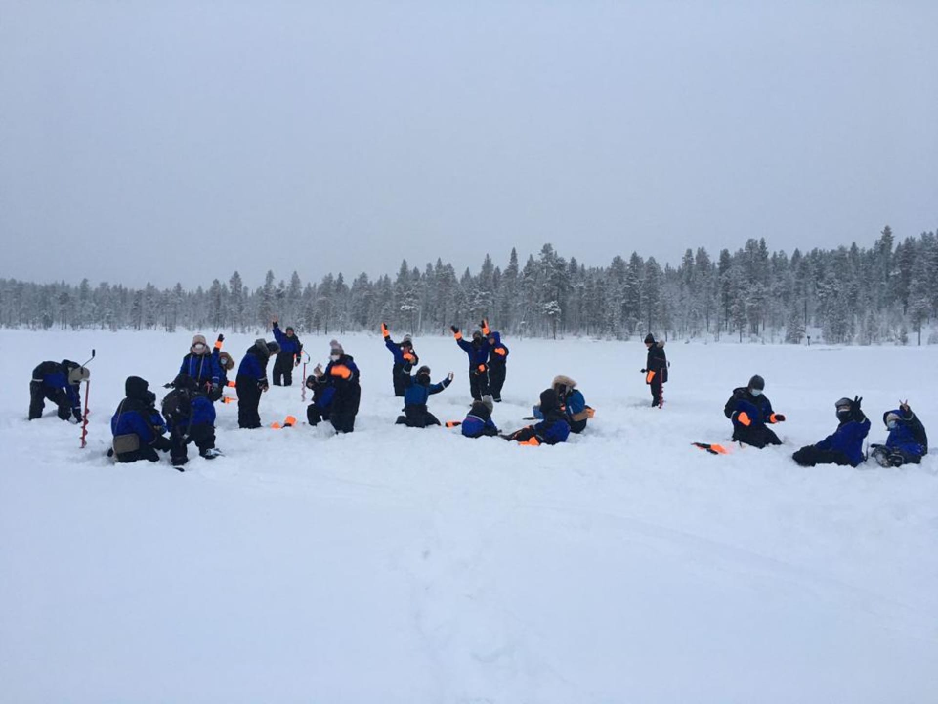 Icefishing safari by snowmobile