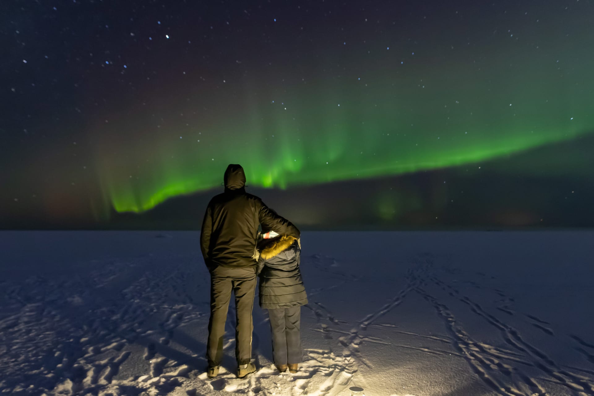 Couple watching the northern lights